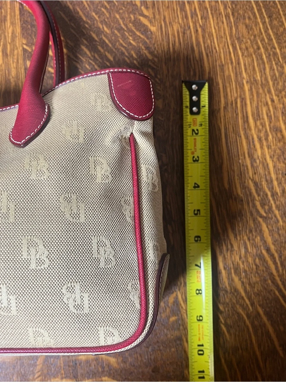 Dooney & Bourke Tan Monogram Canvas Satchel with Red Leather Trim Silver Lock.